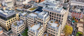 An aerial drone shot showing 90 Long Acre, a flat roofing project carried out by Mac Roofing using BMI Icopal Parabit Solo Hotmelt and Sealoflex Ultima Premium products.